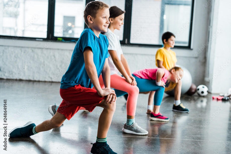 Kids warming up before training in gym